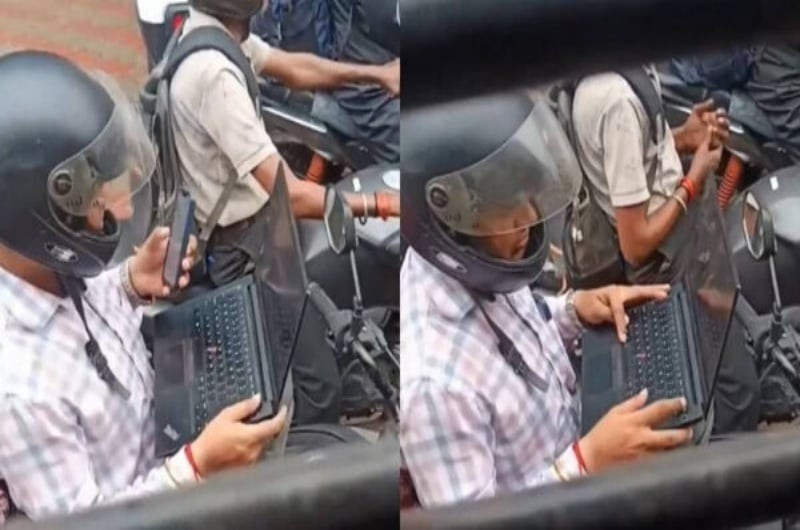 Bức ảnh gây bão mạng toàn thế giới: Mở laptop làm việc khi xe máy chờ đèn đỏ缩略图